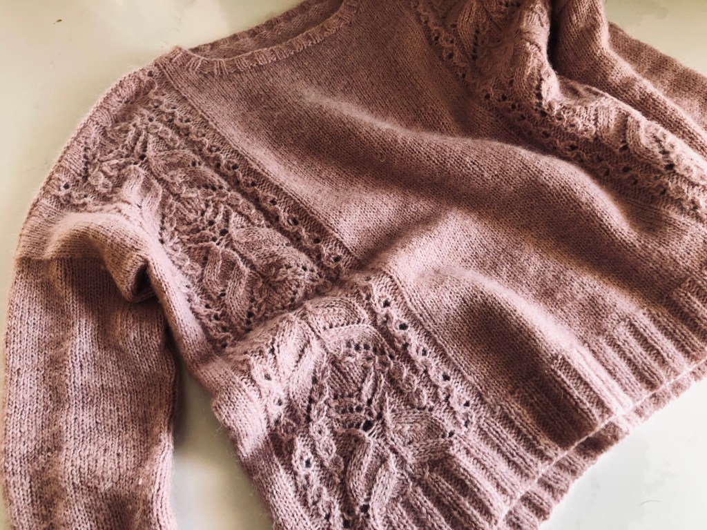 Handmade knitted pink sweater "Pink Fizz" has lace panels on the front and back with stockinette stitch.
